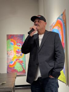 Omar Lopez of AEP Texas speaks at the Art of Drag K Space Contemporary Pride Corpus Christi event.