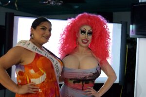 Miss Trans Texas titleholder Kitana Sanchez in a "Miss Trans Texas" sash poses with Brigitte Bandit